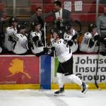 Kenai Rivers Brady Engelkes celebrates a hat trick with his teammates during a game against Fairbanks at the Soldotna Regional Sports Complex in Soldotna, Alaska, on Saturday, Feb. 24, 2024. (Jake Dye/Peninsula Clarion)