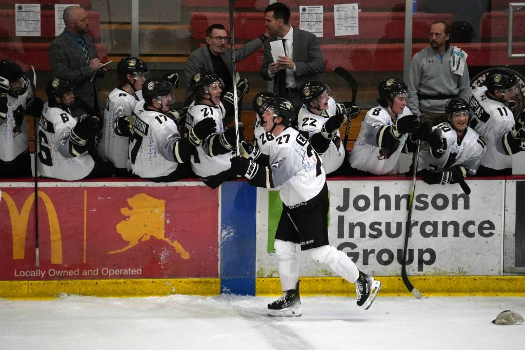 Kenai Rivers Brady Engelkes celebrates a hat trick with his teammates during a game against Fairbanks at the Soldotna Regional Sports Complex in Soldotna, Alaska, on Saturday, Feb. 24, 2024. (Jake Dye/Peninsula Clarion)