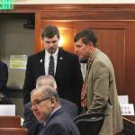 From left: Sen. Jesse Bjorkman, R-Nikiski, and Sen. Bill Wielechowski, D-Anchorage, talk with Sen. Matt Claman during an at-ease on debate on education legislation on Monday, Feb. 26, 2024, in Juneau, Alaska. (Ashlyn OHara/Peninsula Clarion)