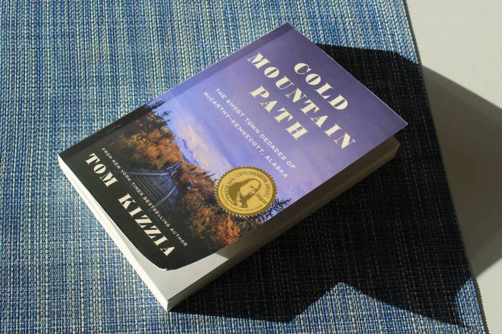 A copy of Tom Kizzias Cold Mountain Path rests on a table on Thursday, Feb. 29, 2024 in Juneau, Alaska. (Ashlyn OHara/Peninsula Clarion)