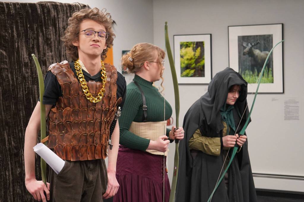Gavin Hunt, JLee Webster and Oshie Broussard rehearse Marian, or the True Tale of Robin Hood at the Kenai Art Center on Thursday, Feb. 29, 2024. (Jake Dye/Peninsula Clarion)