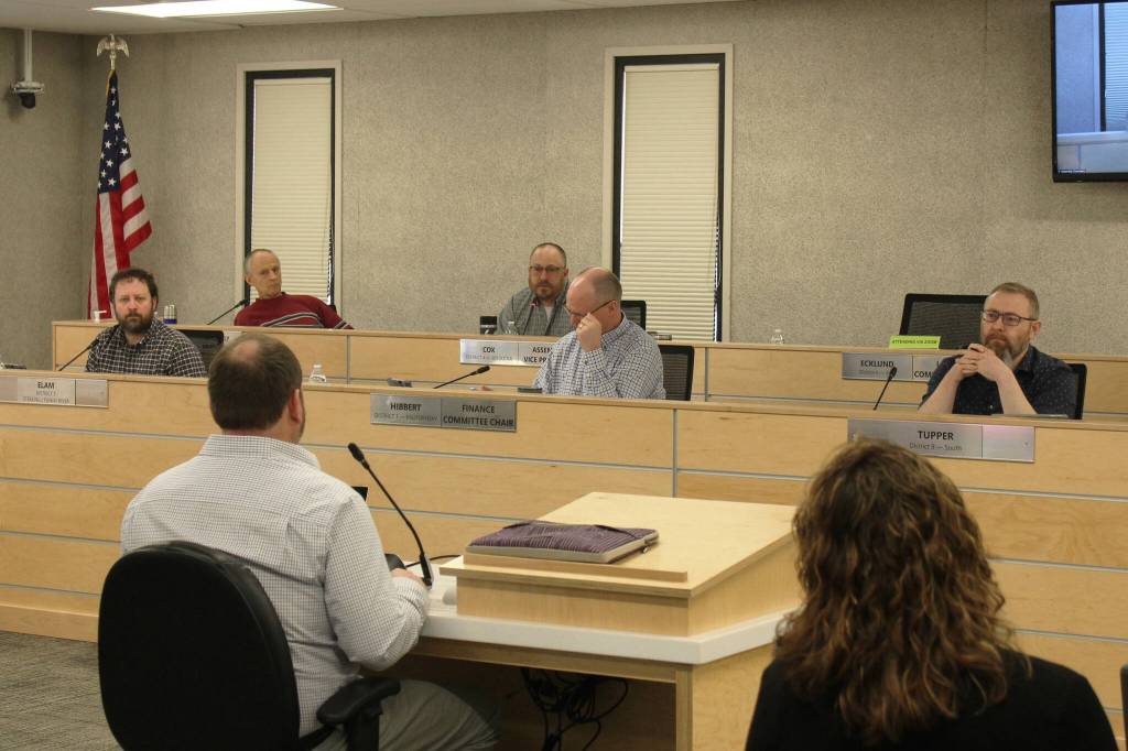 (Foreground) Kenai Peninsula Borough School District Superintendent Clayton Holland, left, and KPBSD Finance Director Liz Hayes, right, speak about the districts fiscal year 2024 budget during a work session with the Kenai Peninsula Borough Assembly on Tuesday, March 14, 2023, in Soldotna, Alaska. (Ashlyn OHara/Peninsula Clarion)