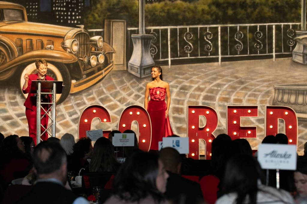 Sara DeVolld wears Heartlight, a dress she designed that was featured in this years Alaskas Red Dress Collection. (Photo provided by Shona DeVolld)