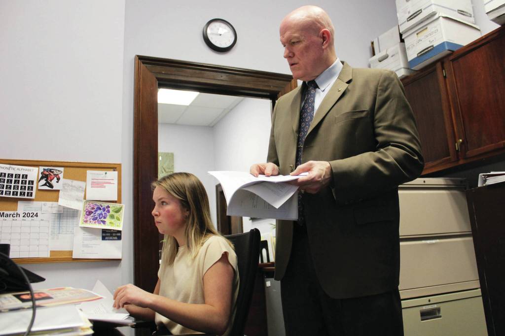 Ashlyn OHara/Peninsula Clarion
Bud Sexton, chief of staff for Alaska House Rep. Justin Ruffridge, and aide Sabina Braun, left, review amendment language in their office at the Alaska State Capitol building on Wednesday in Juneau.