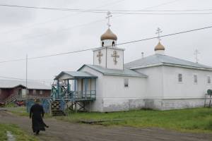 An Alaska Native man walks towards an Orthodox church in a screenshot from Sacred Alaska. (Promotional image courtesy Simon Scionka)
