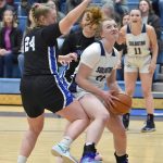 Soldotnas Hope Hillyer drives against Palmers Abby Pettit on Thursday, March 7, 2024, at the Northern Lights Conference tournament at Soldotna High School in Soldotna, Alaska. (Photo by Jeff Helminiak/Peninsula Clarion)