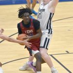 Darian Igwacho of Mountain City Christian Academy is pressured by Soldotnas Theo Huff on Thursday, March 7, 2024, at the Northern Lights Conference tournament at Soldotna High School in Soldotna, Alaska. (Photo by Jeff Helminiak/Peninsula Clarion)