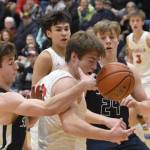 Soldotnas Zac Buckbee and Wasillas Eli Cox battle for the ball Friday, March 8, 2024, at the Northern Lights Conference tournament at Soldotna High School in Soldotna, Alaska. (Photo by Jeff Helminiak/Peninsula Clarion)
