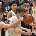 Soldotna's Zac Buckbee and Wasilla's Eli Cox battle for the ball Friday, March 8, 2024, at the Northern Lights Conference tournament at Soldotna High School in Soldotna, Alaska. (Photo by Jeff Helminiak/Peninsula Clarion)