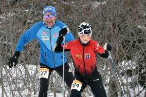 NIva Flagstad, 11, leads her father, Trond Flagstad, associate head coach for men's and women's Nordic skiing at the University of Alaska Anchorage, up a long climb in the Kachemak Ski Marathon just outside of Homer, Alaska, on Saturday, March 16, 2024. (Photo by Erin Thompson/Peninsula Clarion)