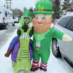 Photo provided by Sara Hondel
Sara Hondel stands with a leprechaun during Sweeneys St. Patricks Day Parade in Soldotna on Sunday. Green, leprechauns and Nugget the Moose poured down the streets for the 34th annual parade hosted by the Soldotna Chamber of Commerce. Under cloudy skies  but fortunately no precipitation  a procession of viridescent celebrants representing businesses and organizations brought festivities to an array of attendees lining Redoubt Avenue.