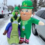 Sara Hondel stands with a leprechaun during the Sweeneys St. Patricks Day Parade in Soldotna, Alaska, on Sunday, March 17, 2024. (Photo provided by Sara Hondel)