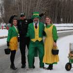 Soldotna Police Chief Gene Meek stands for a photo with participants of the Sweeneys St. Patricks Day Parade in Soldotna, Alaska, on Sunday, March 17, 2024. (Photo provided by Shona DeVolld)
