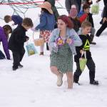 Jake Dye/Peninsula Clarion
Children hunt for Easter eggs during the Easter Eggstravaganza at Nikiski Community Recreation Center on Saturday.