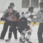Ryan Hipsag of the Kenai River Brown Bears and Kole Altergott of the Minnesota Wilderness fight Saturday, March 23, 2024, at the Soldotna Regional Sports Complex in Soldotna, Alaska. (Photo by Jeff Helminiak/Peninsula Clarion)