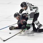 Owen Hanson of the Kenai River Brown Bears draws a tripping penalty on Nash Jacobsma of the Minnesota Wilderness on Saturday, March 23, 2024, at the Soldotna Regional Sports Complex in Soldotna, Alaska. (Photo by Jeff Helminiak/Peninsula Clarion)