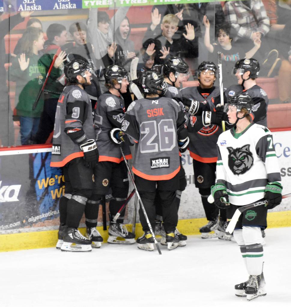 Young fans help the Kenai River Brown Bears celebrate the goal of Landon MacDonald on Saturday, March 23, 2024, at the Soldotna Regional Sports Complex in Soldotna, Alaska. (Photo by Jeff Helminiak/Peninsula Clarion)