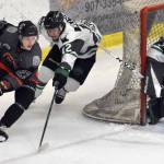 Roope Tuomioksa of the Kenai River Brown Bears attacks Payton Nelson and goalie Nick Erickson of the Minnesota Wilderness on Saturday, March 23, 2024, at the Soldotna Regional Sports Complex in Soldotna, Alaska. (Photo by Jeff Helminiak/Peninsula Clarion)