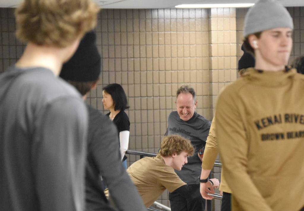 Candace Nakagawa and John Bryan, Co-Directors of Sports Science, Strength and Conditioning for the Kenai River Brown Bears, run a warmup session at the Soldotna Regional Sports Complex in Soldotna, Alaska, on Friday, March 29, 2024. (Photo by Jeff Helminiak/Peninsula Clarion)