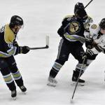 Brady Engelkes of the Kenai River Brown Bears battles for the puck with Max Wagener and Ikki Kogawa of the Janesville (Wisconsin) Jets on Sunday, March 31, 2024, at the Soldotna Regional Sports Complex in Soldotna, Alaska. (Photo by Jeff Helminiak/Peninsula Clarion)
