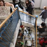 Students climb the stairs at the Alaska State Capital on Thursday morning after marching from Juneau-Douglas High School: Yadaa.at Kalé as part of a statewide protest calling for more public school funding. (Mark Sabbatini / Juneau Empire)