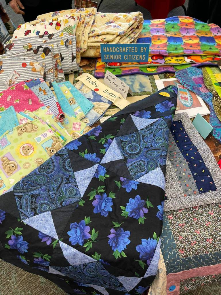 Items handcrafted by senior citizens are ready for auction in the annual March for Meals fundraiser at the Kenai Senior Center in Kenai, Alaska, on Friday, April 5, 2024. (Photo by Terry Turner, provided by Kenai Senior Center)