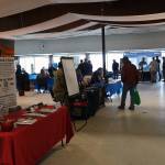 Attendees mill between vendor tables during the Kenai Peninsula Job and Career Fair in Kenai, Alaska, on Wednesday, April 10, 2024. (Jake Dye/Peninsula Clarion)