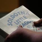 Soldotna Little League Board President Billy Cannon holds a binder moments before presenting to the Soldotna City Council during their meeting in Soldotna, Alaska, on Wednesday, April 10, 2024. (Jake Dye/Peninsula Clarion)