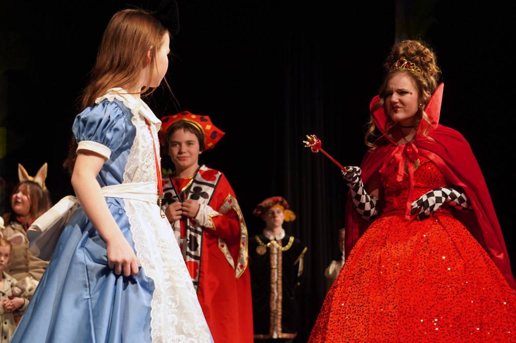 Aurora Bukac is Alice and Sophia Hughes is the Queen of Hearts in a rehearsal of Seward High School Theatre Collectives production of Alice in Wonderland at Seward High School in Seward, Alaska, on Thursday, April 11, 2024. (Jake Dye/Peninsula Clarion)