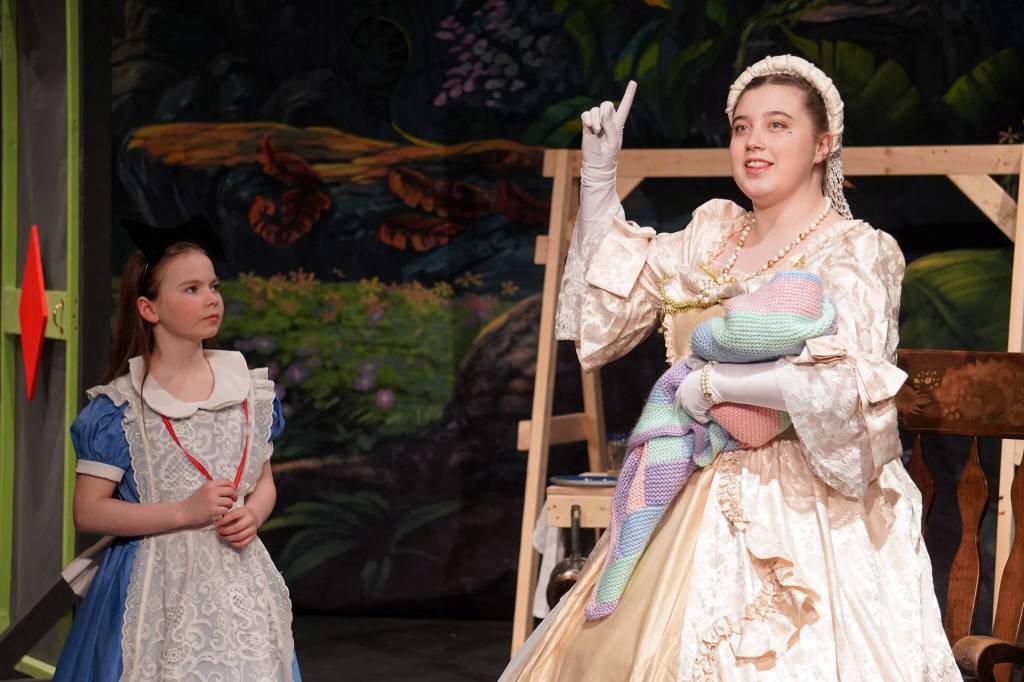 Aurora Bukac is Alice and Angel Wagner is Duchess in a rehearsal of Seward High School Theatre Collectives production of Alice in Wonderland at Seward High School in Seward, Alaska, on Thursday, April 11, 2024. (Jake Dye/Peninsula Clarion)