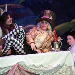 Lily Biocic is March Hare, Lily Mooter is Hatter and Aurora Bukac is Alice in a rehearsal of Seward High School Theatre Collectives production of Alice in Wonderland at Seward High School in Seward, Alaska, on Thursday, April 11, 2024. (Jake Dye/Peninsula Clarion)