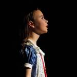 Aurora Bukac is Alice in a rehearsal of Seward High School Theatre Collectives production of Alice in Wonderland at Seward High School in Seward, Alaska, on Thursday, April 11, 2024. (Jake Dye/Peninsula Clarion)