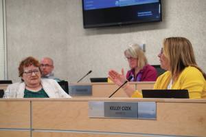 Jake Dye/Peninsula Clarion
Kelley Cizek, right, speaks as Jason Tauriainen, Patti Truesdell and Penny Vadla listen during a special meeting of the Kenai Peninsula Borough School Districts school board in Soldotna on Monday.