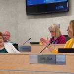 School board member Kelley Cizek, right, speaks as members Jason Tauriainen, Patti Truesdell and Penny Vadla listen during a special meeting of the Kenai Peninsula Borough School Districts School Board in Soldotna, Alaska, on Monday, April 15, 2024. (Jake Dye/Peninsula Clarion)