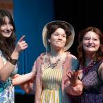 Leora McCaughey, Maggie Grenier and Oshie Broussard rehearse Mamma Mia at Nikiski Middle/High School in Nikiski, Alaska, on Tuesday, April 16, 2024. (Jake Dye/Peninsula Clarion)
