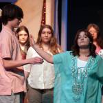 Oshie Broussard, right, and the cast of Nikiski Bulldog Theaters Mamma Mia rehearse at Nikiski Middle/High School in Nikiski, Alaska, on Tuesday, April 16, 2024. (Jake Dye/Peninsula Clarion)