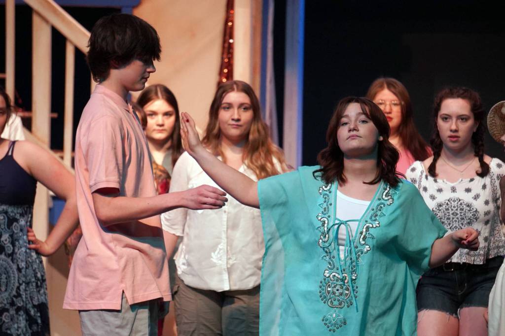 Oshie Broussard, right, and the cast of Nikiski Bulldog Theaters Mamma Mia rehearse at Nikiski Middle/High School in Nikiski, Alaska, on Tuesday, April 16, 2024. (Jake Dye/Peninsula Clarion)
