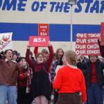 JLee Webster leads students of Soldotna High School in a chant during a walkout in protest of the veto of Senate Bill 140 in front of their school in Soldotna, Alaska, on Wednesday, April 17, 2024. (Jake Dye/Peninsula Clarion)