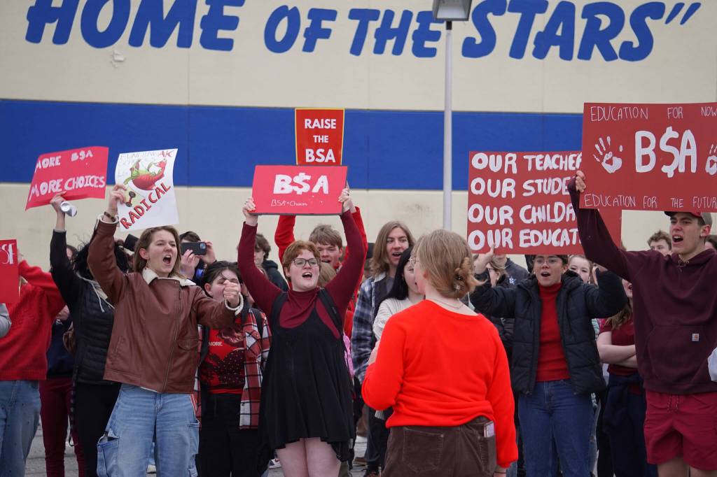 JLee Webster leads students of Soldotna High School in a chant during a walkout in protest of the veto of Senate Bill 140 in front of their school in Soldotna, Alaska, on Wednesday, April 17, 2024. (Jake Dye/Peninsula Clarion)