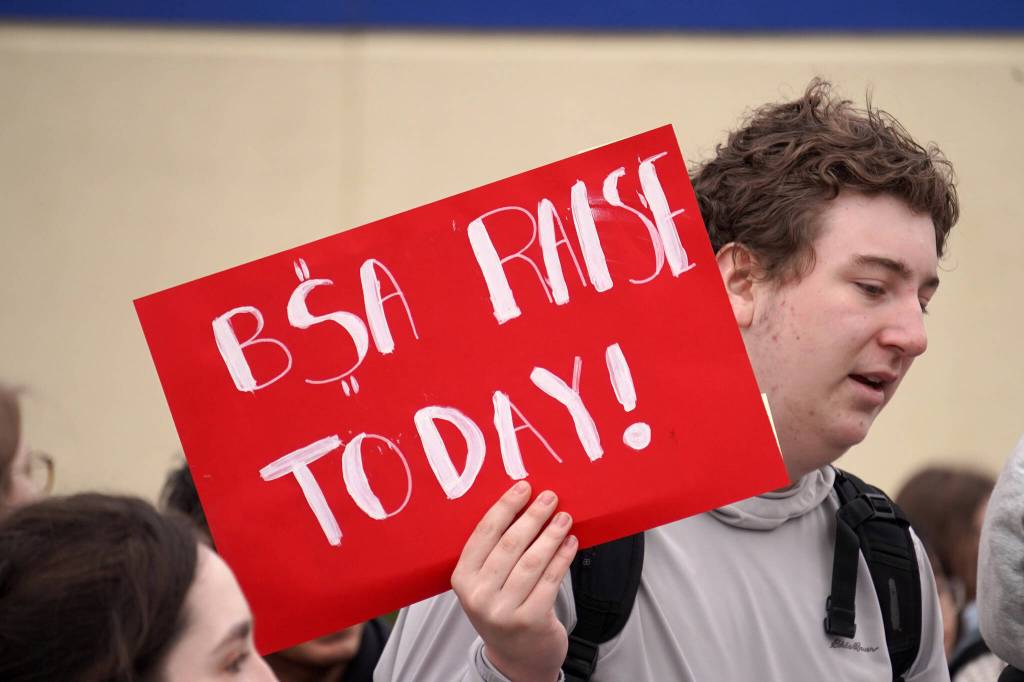 Sean Norris joins other students of Soldotna High School as they stage a walkout in protest of the veto of Senate Bill 140 in front of their school in Soldotna, Alaska, on Wednesday, April 17, 2024. (Jake Dye/Peninsula Clarion)