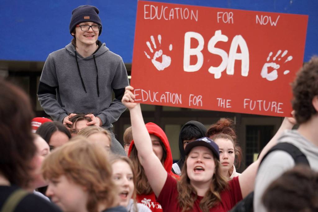 Students of Soldotna High School stage a walkout in protest of the veto of Senate Bill 140 in front of their school in Soldotna, Alaska, on Wednesday, April 17, 2024. (Jake Dye/Peninsula Clarion)