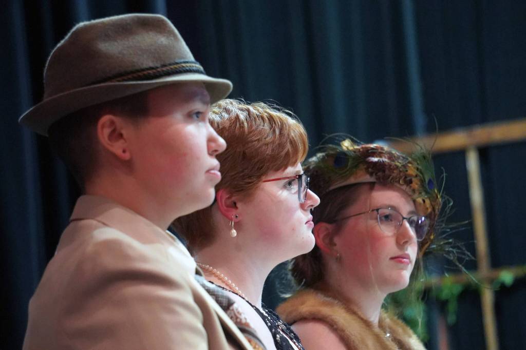 Chloe Jacko, Ada Bon and Emerson Kapp rehearse Clue at Soldotna High School in Soldotna, Alaska, on Thursday, April 18, 2024. (Jake Dye/Peninsula Clarion)