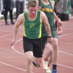 Nick Ambrosiani hands to Ronan Bickling in the 400-meter relay Saturday, April 20, 2024, at the Soldotna Invitational at Soldotna High School in Soldotna, Alaska. (Photo by Jeff Helminiak/Peninsula Clarion)