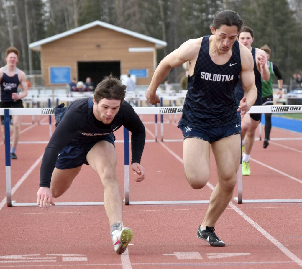 Soldotnas Wyatt Faircloth (left) edges out teammate Gabriel Almeida for the victory in the 300-meter hurdles Saturday, April 20, 2024, at the Soldotna Invitational at Soldotna High School in Soldotna, Alaska. (Photo by Jeff Helminiak/Peninsula Clarion)
