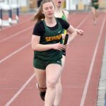 Sewards Juniper Ingalls hands the baton to Hailey Ingalls in the 3,200-meter relay Saturday, April 20, 2024, at the Soldotna Invitational at Soldotna High School in Soldotna, Alaska. (Photo by Jeff Helminiak/Peninsula Clarion)