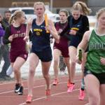 Homers Brightly Thoning hands to Gracie Miotke in the 1,600-meter relay Saturday, April 20, 2024, at the Soldotna Invitational at Soldotna High School in Soldotna, Alaska. (Photo by Jeff Helminiak/Peninsula Clarion)