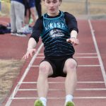 Nikiskis Thayne Quiner competes in the long jump Saturday, April 20, 2024, at the Soldotna Invitational at Soldotna High School in Soldotna, Alaska. (Photo by Jeff Helminiak/Peninsula Clarion)