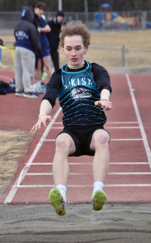 Nikiskis Thayne Quiner competes in the long jump Saturday, April 20, 2024, at the Soldotna Invitational at Soldotna High School in Soldotna, Alaska. (Photo by Jeff Helminiak/Peninsula Clarion)
