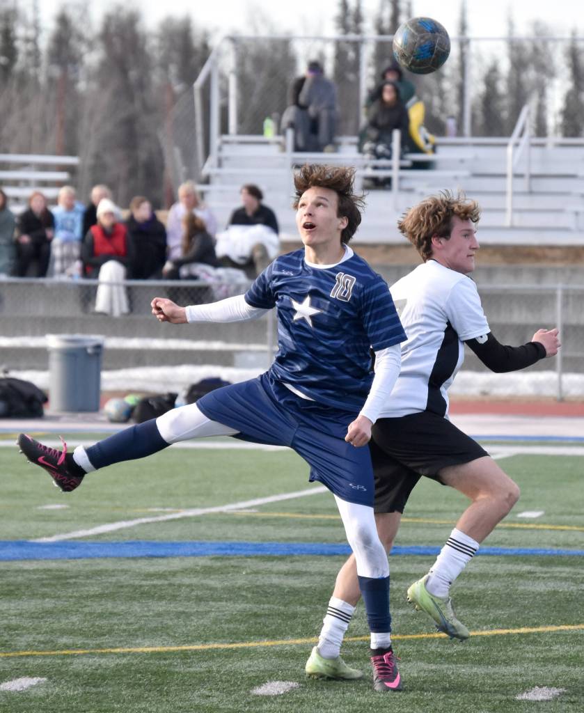 Soldotnas Daniel Heath and Kenai Centrals Aloshia Cross battle for the ball Tuesday, April 23, 2024, at Soldotna High School in Soldotna, Alaska. (Photo by Jeff Helminiak/Peninsula Clarion)