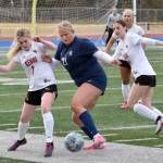 Soldotnas Morgan Lemm tries to turn on Kenai Centrals Tait Cooper on Tuesday, April 23, 2024, at Soldotna High School in Soldotna, Alaska. (Photo by Jeff Helminiak/Peninsula Clarion)